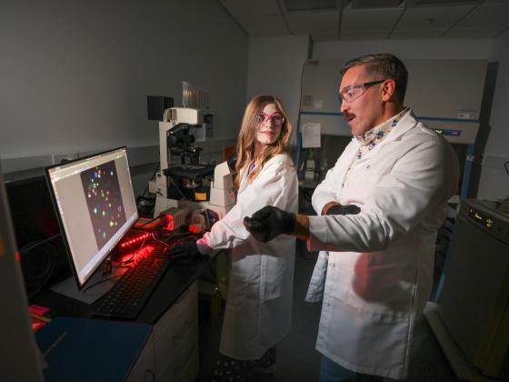 a photo of two researchers in a lab